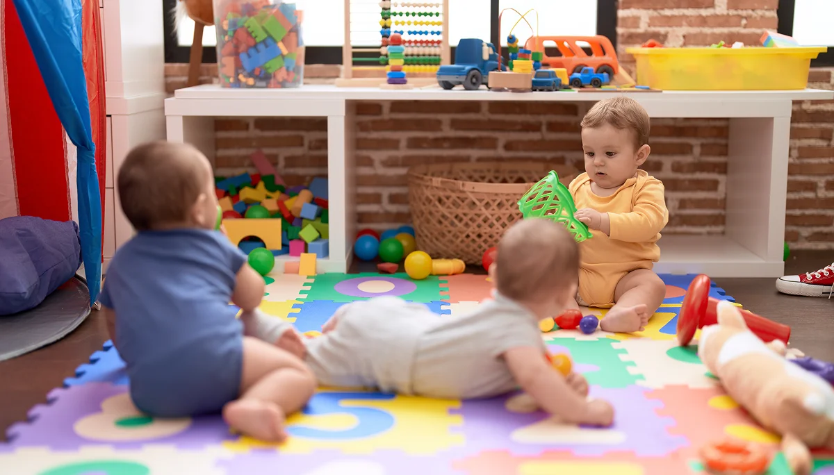 Infants are playing at the best daycare in Houston Panda Bear Academy.