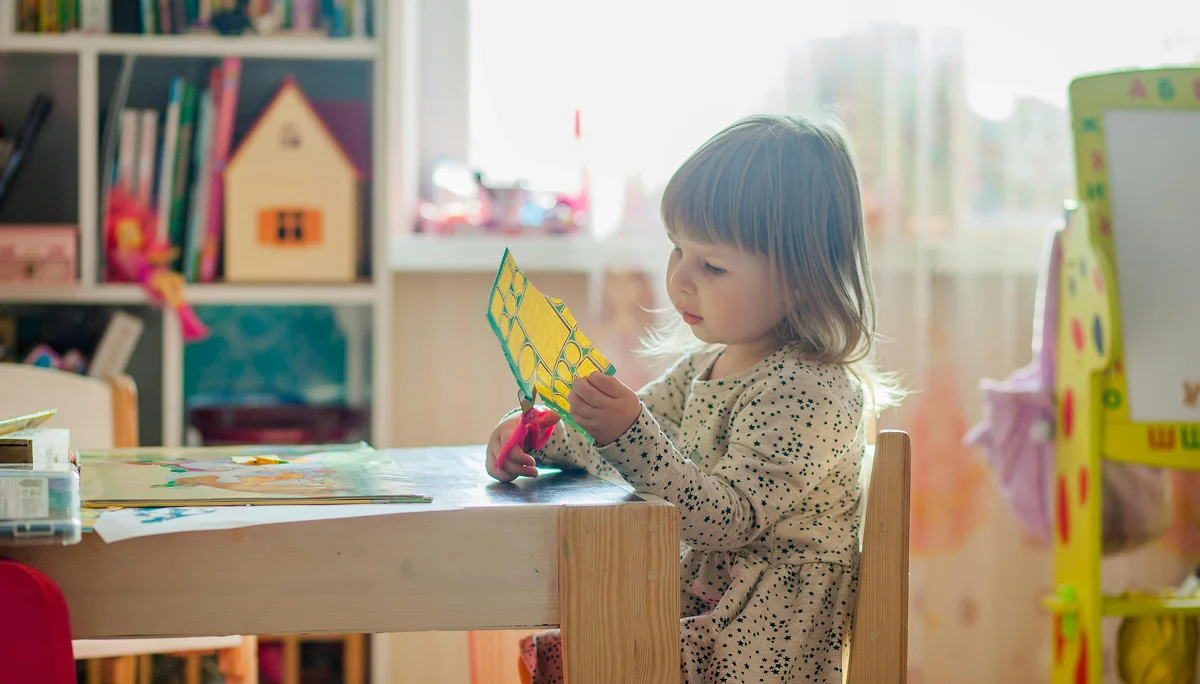 A newly enrolled child in Panda Bear Academy's preschool program is playing
